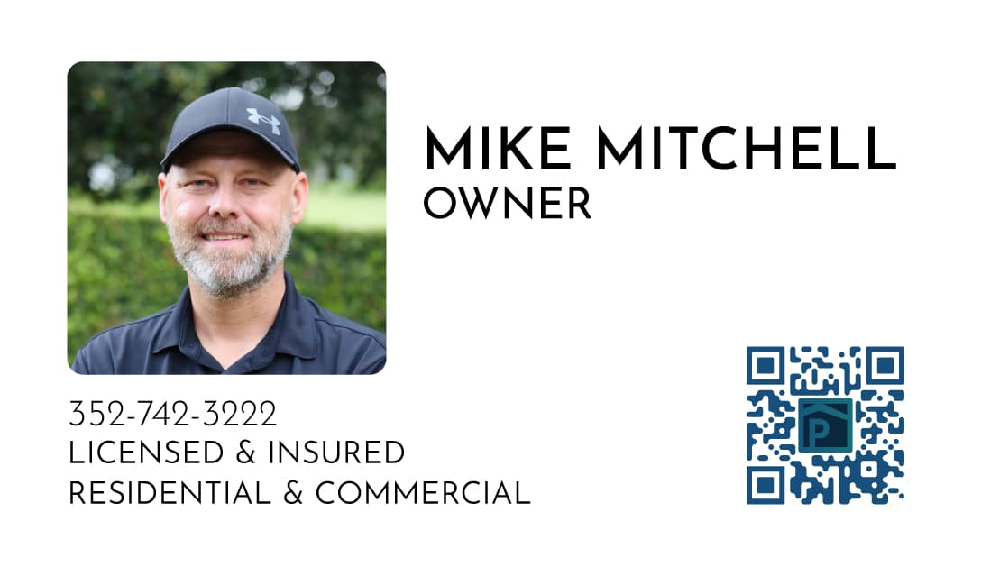 Back of the Precision business card with Mike Mitchell’s photo, phone number and a QR code
